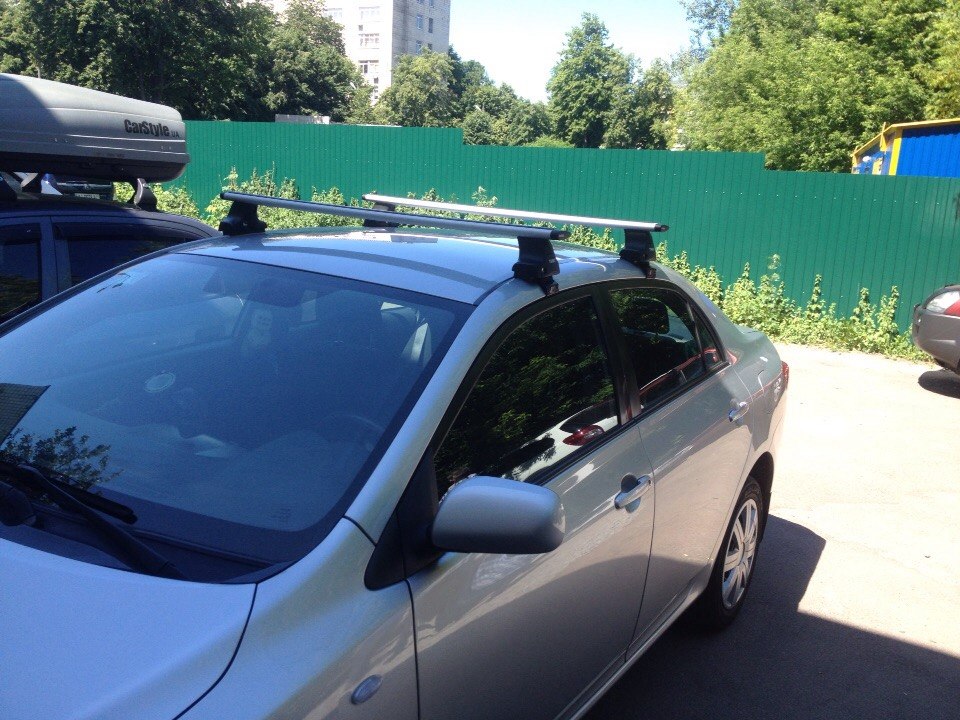 Toyota Corolla + CarStyle WingStyle + Thule-754